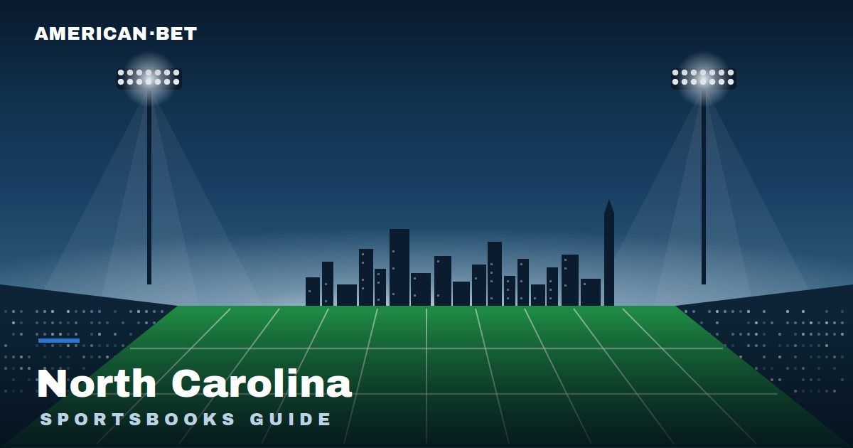 Floodlit stadium at dusk with the North Carolina skyline — American Bet's guide to the best North Carolina sportsbooks, betting apps and promos.