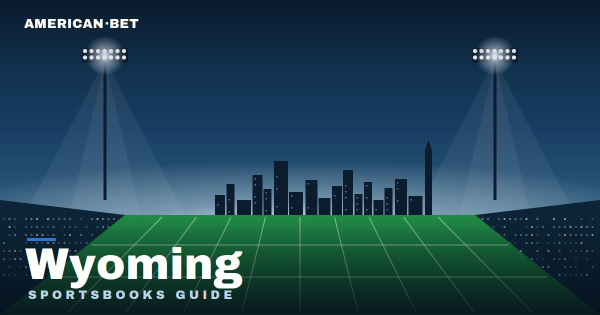 Floodlit stadium at dusk with the Wyoming skyline — American Bet's guide to the best Wyoming sportsbooks, betting apps and promos.
